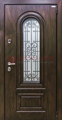 Темная филенчатая железная дверь со стеклом и ковкой ДСК-102 в Севастополе