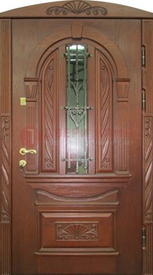 Узорная железная дверь массив со стеклом и ковкой ДСК-247 в Севастополе