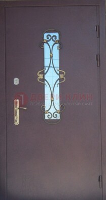 Металлическая дверь со стеклом и ковкой ДСК-77 в Севастополе